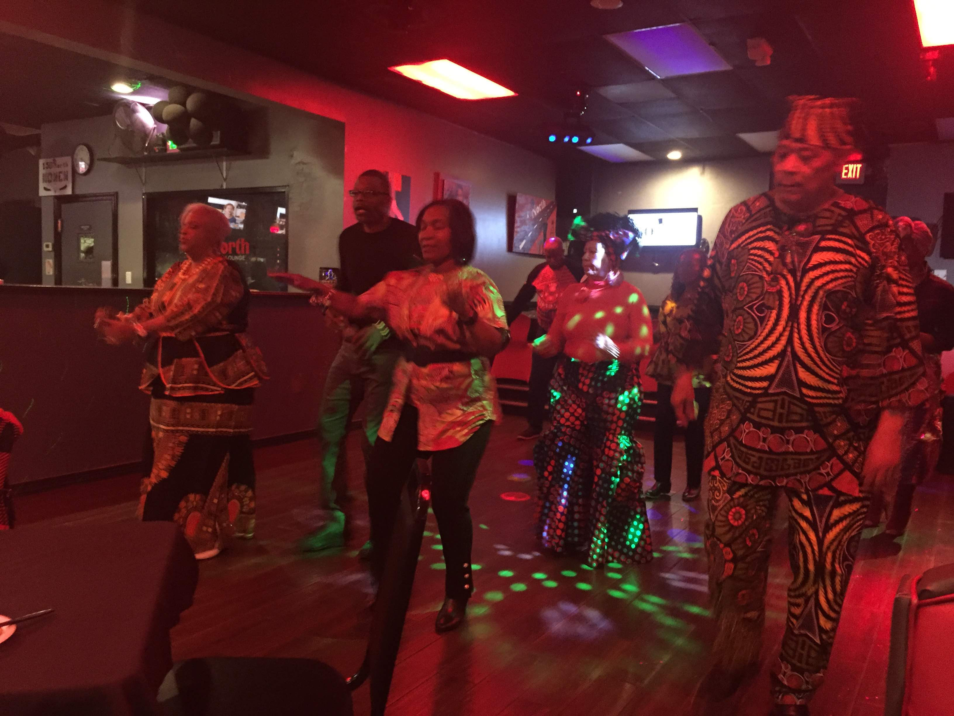 Brothers and guests celebrate in traditional African attire at Omicron Omega’s February 29, 2020 Black History Month gathering.